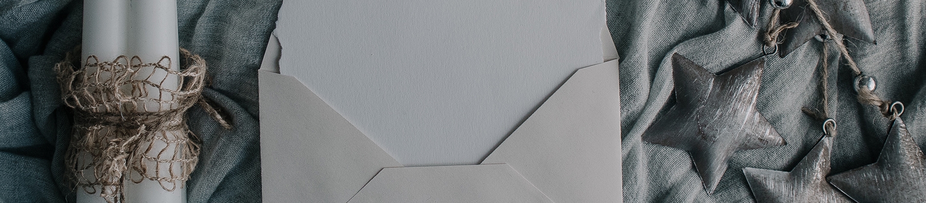 A open letter on blue material with ornaments either side A open letter on blue material with ornaments either side