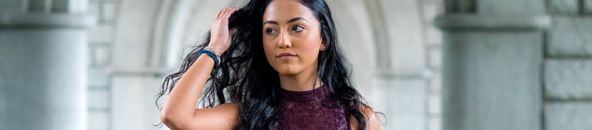 A women in a purple dress looking away A women in a purple dress looking away