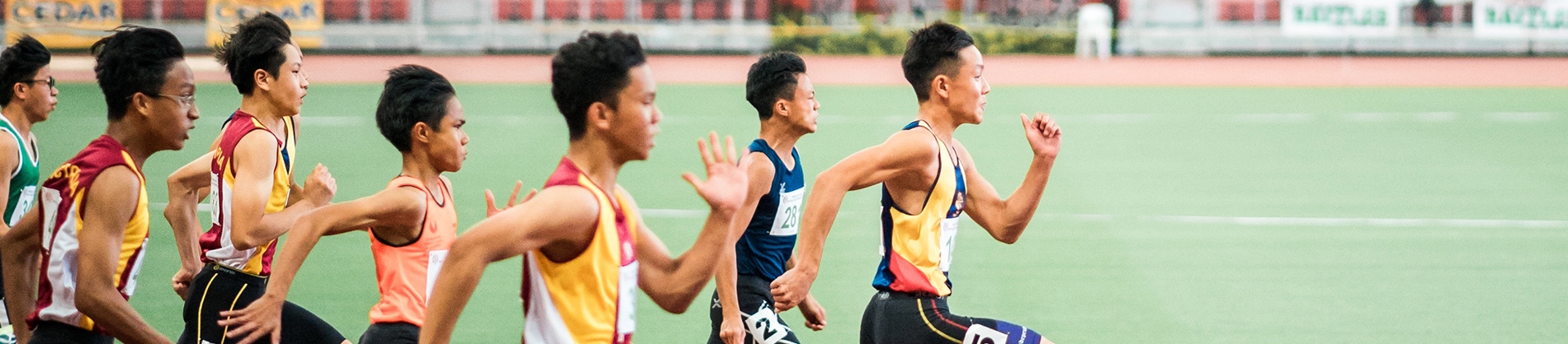 A group of men running in a race A group of men running in a race