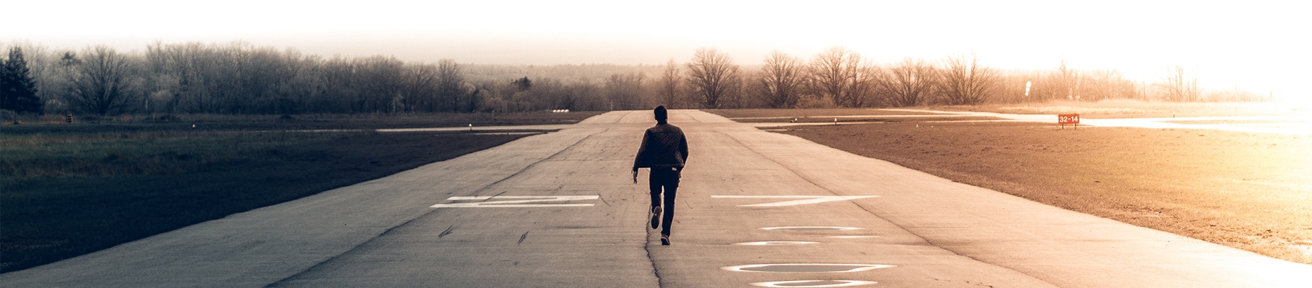 A man running down a runway A man running down a runway