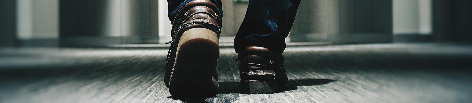 Man walking down a corridor