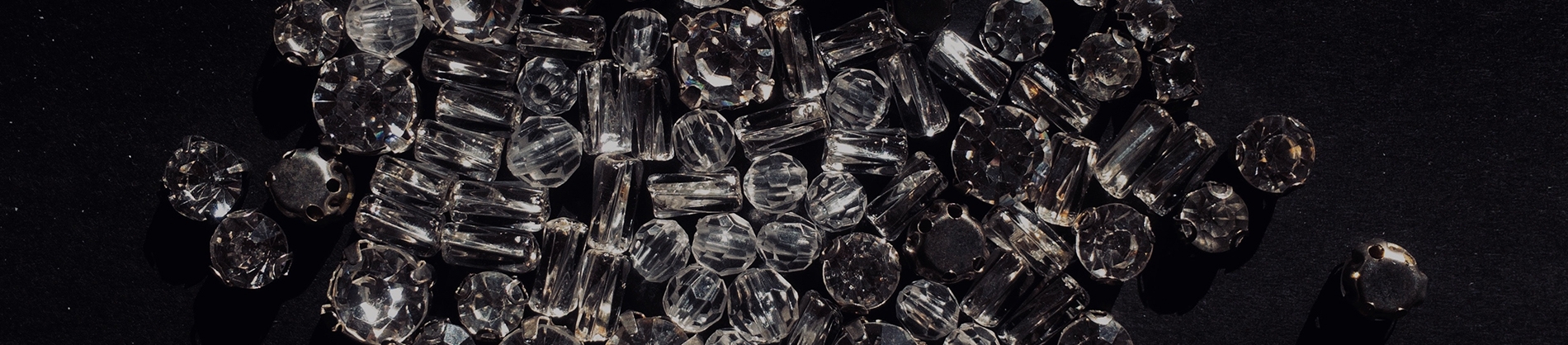 Lots of small diamonds on a black background Lots of small diamonds on a black background