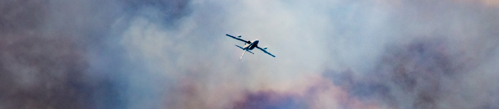 A plane flying through clouds A plane flying through clouds