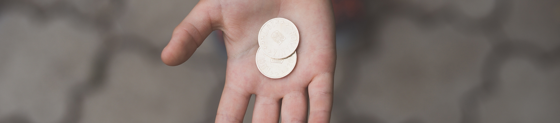Coins in the palm of someones hand Coins in the palm of someones hand