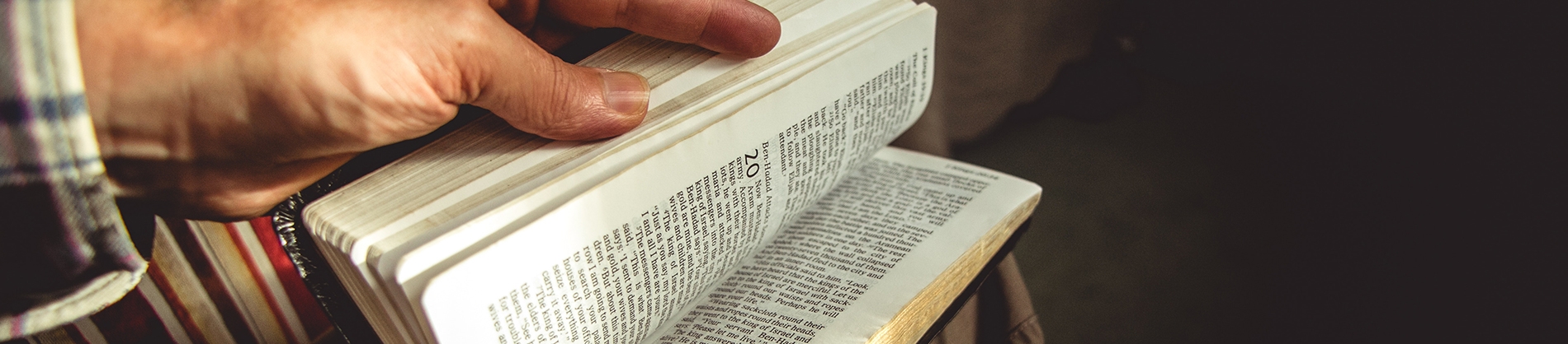 A man opening a bible A man opening a bible