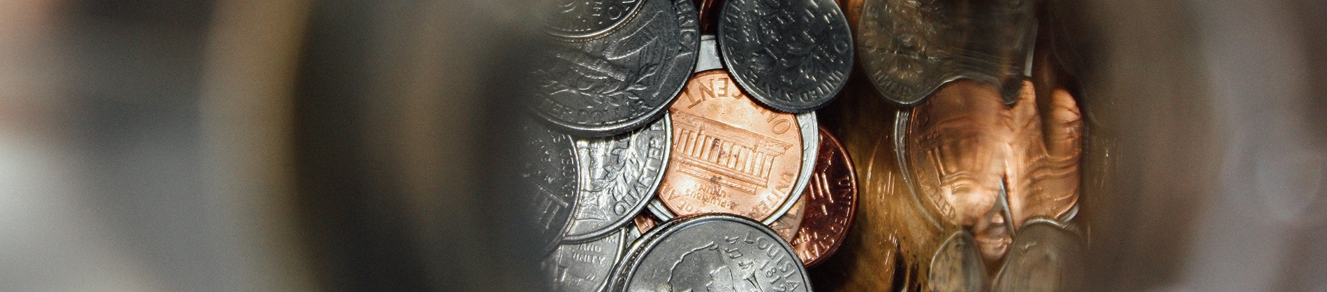 A glass jar of coins A glass jar of coins