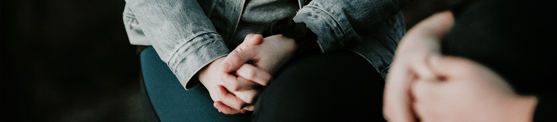 A women with her hands together in prayer A women with her hands together in prayer