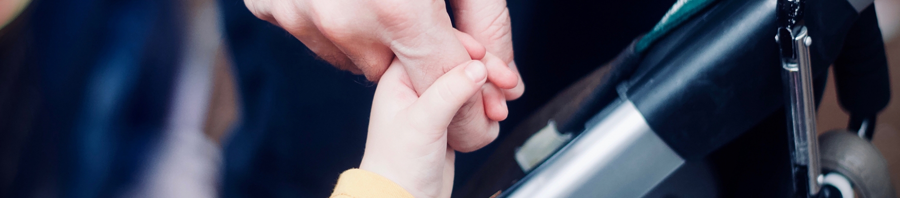 A child holding a parents finger A child holding a parents finger