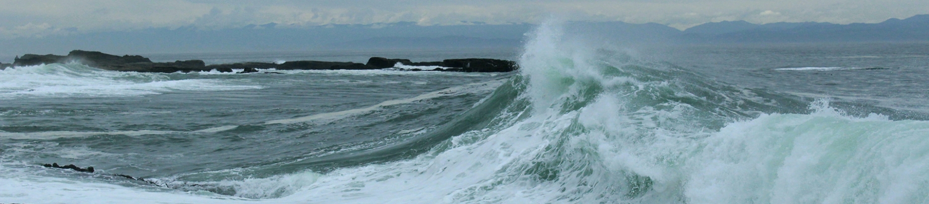 A wave crashing into the shore A wave crashing into the shore